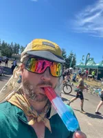 Me during the 2023 Seattle to Portland ride. I am wearing my Partypace cycling cap with a bandanna underneath, ridiculous cycling glasses, and another bandanna tied around my neck in a jaunty fashion.